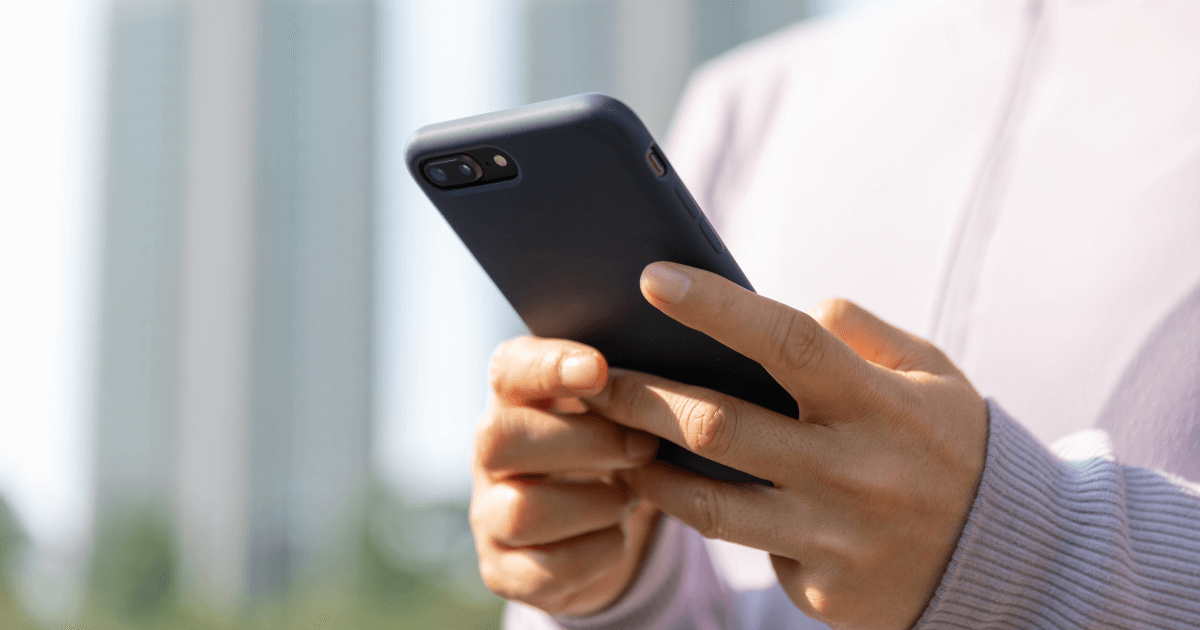 person texting on phone