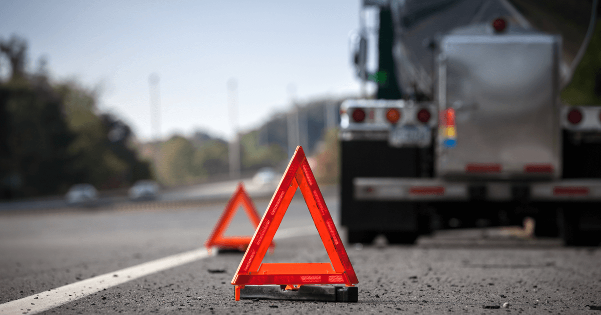 hazard sign by a semi-truck