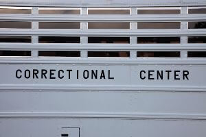 white correctional facility bus