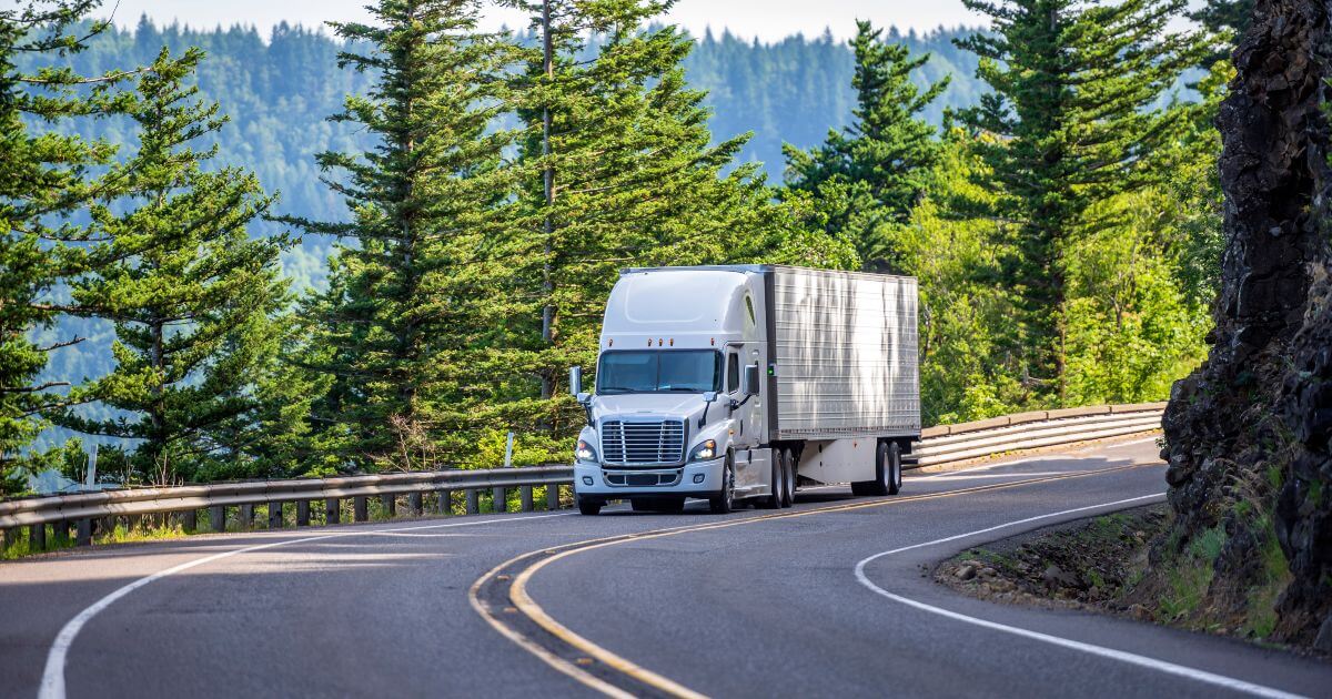 commercial truck turning in forest