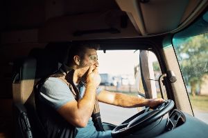 fatigued truck driver on road