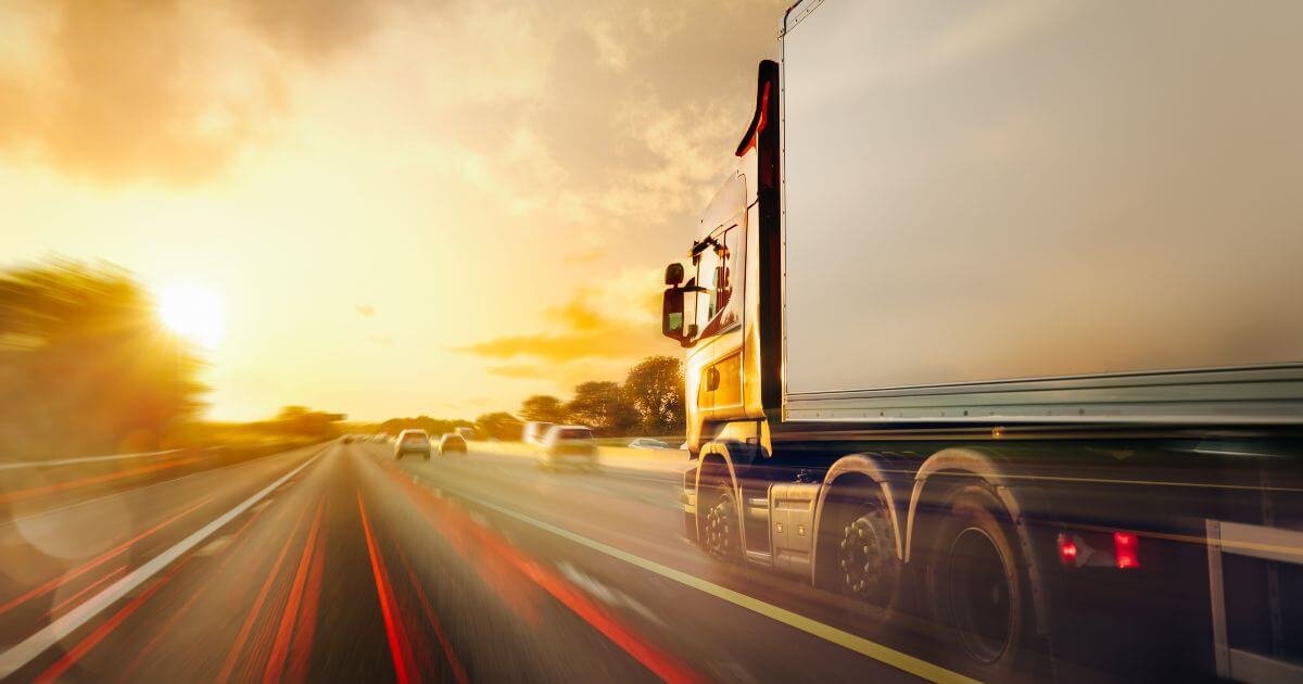 car next to commercial truck
