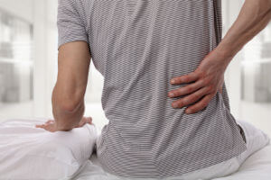 person holding a sore back