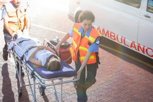 emergency workers moving an injury victim