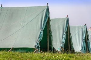 green tents lined up outside
