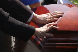 hands on coffin