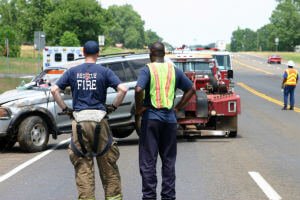 responders looking at a car wreck