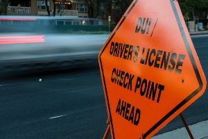 orange sign for dui checkpoint ahead