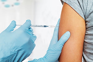 administering vaccine