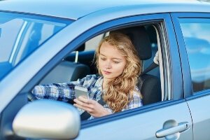 woman engaged in distracted driving