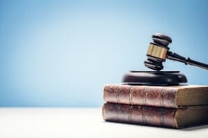 judges gavel on legal books