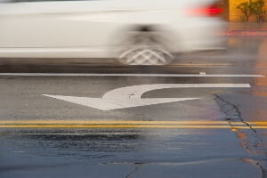 Image of left-turn arrow in road