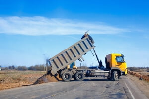 photo illustration of a construction dump truck